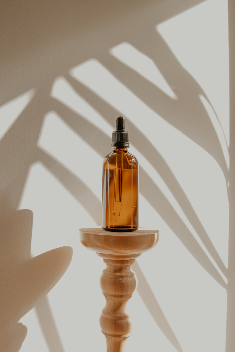 Amber glass dropper bottle on a neutral surface
